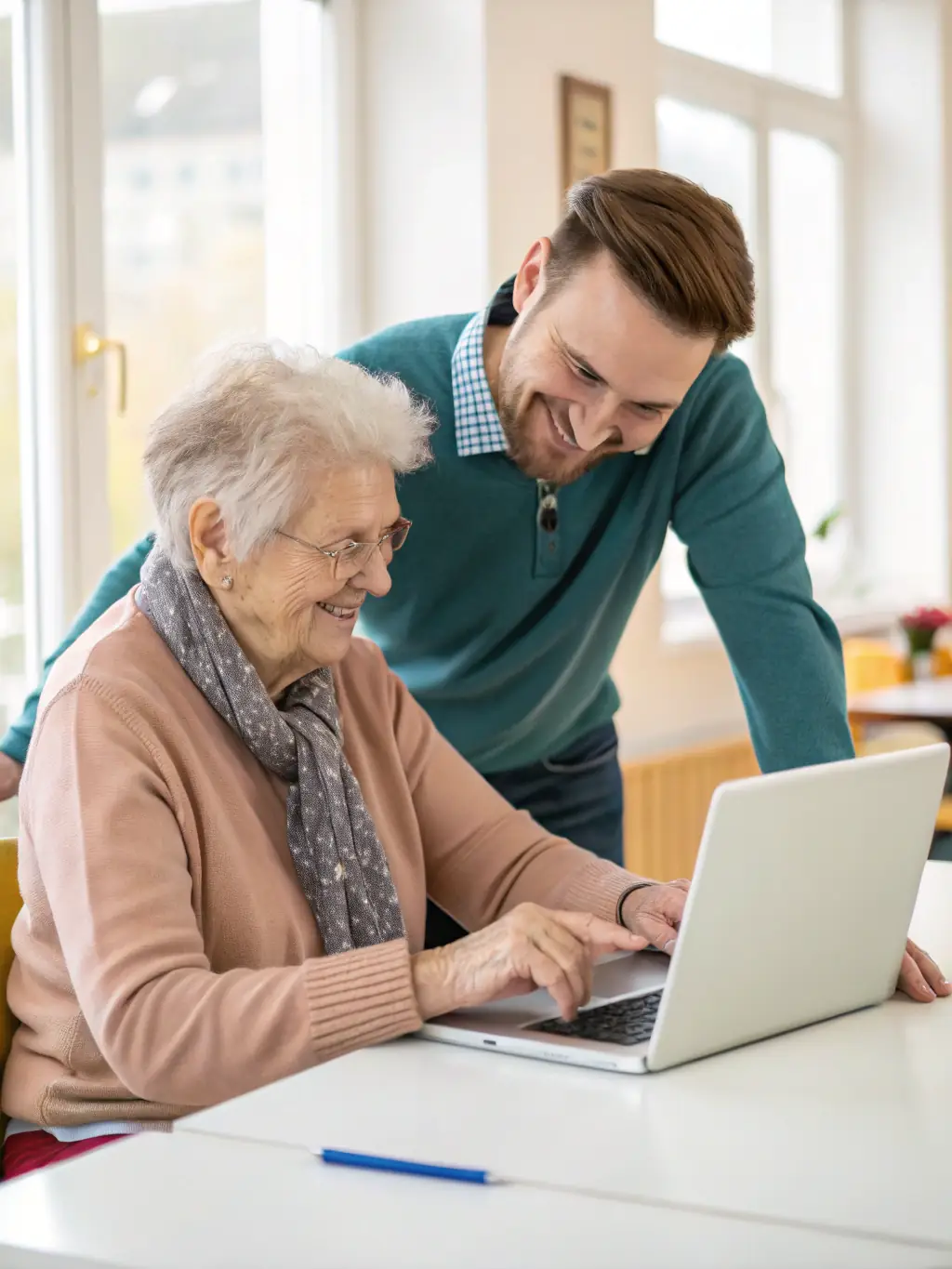 A workshop session where SAUVEGARDE volunteers are teaching digital literacy skills to senior citizens, promoting inclusivity and lifelong learning.